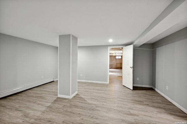 finished basement with baseboards, recessed lighting, and wood finished floors