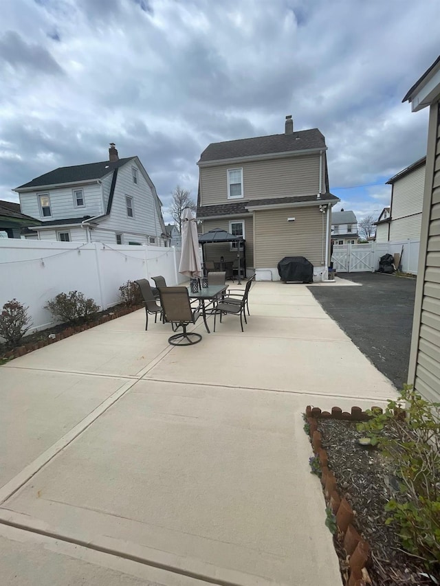 view of patio featuring outdoor dining area and a fenced backyard