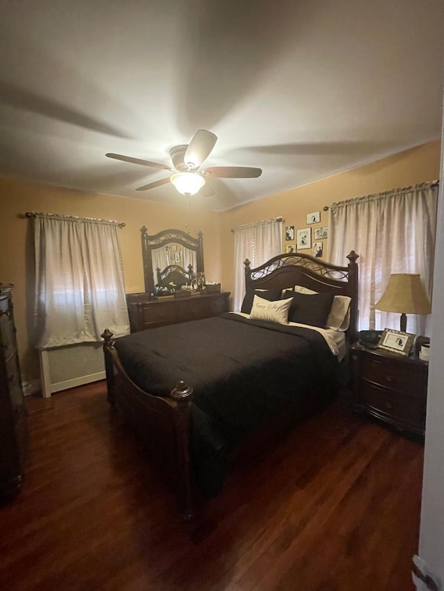bedroom featuring dark wood-type flooring and a ceiling fan