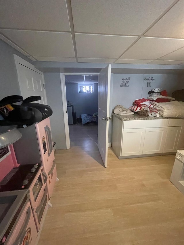 interior space with washer / clothes dryer and light wood-style flooring