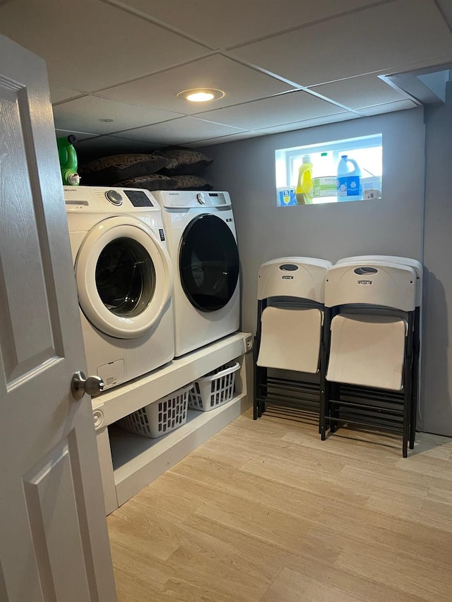 laundry room with washer and dryer, laundry area, wood finished floors, and recessed lighting