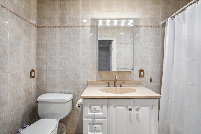 bathroom featuring tile walls, curtained shower, toilet, and vanity