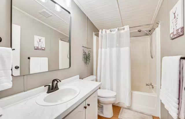 bathroom with shower / bath combo, vanity, toilet, and wood finished floors