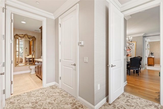 1 Christie Pl Unit 205W, Scarsdale, NY 10583 - hallway with a chandelier, crown molding, and baseboards