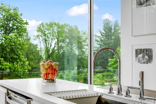 112 Wilson Park Dr, Tarrytown, NY 10591 - kitchen view of a sink, white cabinets, and light countertops