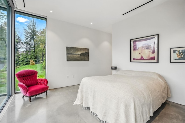 112 Wilson Park Dr, Tarrytown, NY 10591 - bedroom with concrete floors, expansive windows, and recessed lighting