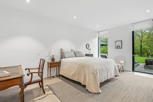 112 Wilson Park Dr, Tarrytown, NY 10591 - bedroom with access to outside, recessed lighting, a wall of windows, and concrete floors