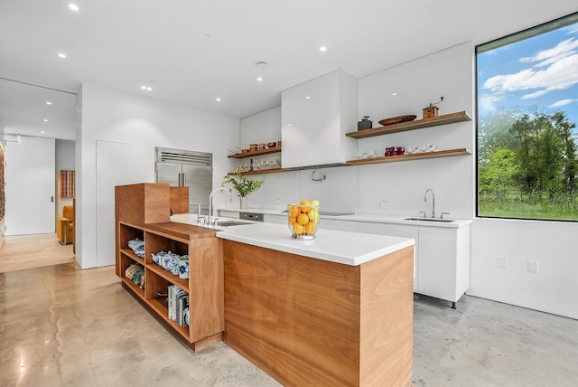 112 Wilson Park Dr, Tarrytown, NY 10591 - kitchen featuring open shelves, stainless steel built in refrigerator, modern cabinets, a sink, and finished concrete floors