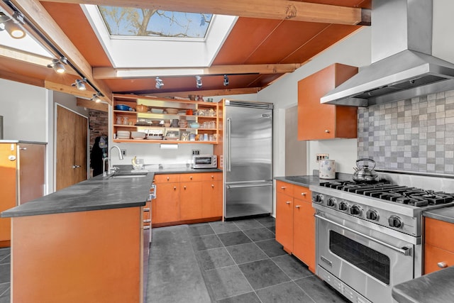 kitchen with a sink, decorative backsplash, open shelves, wall chimney exhaust hood, and high quality appliances