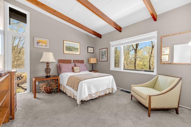 carpeted bedroom featuring baseboards, visible vents, and vaulted ceiling with beams