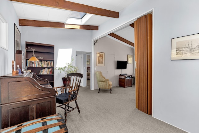 office space featuring lofted ceiling with beams and carpet floors