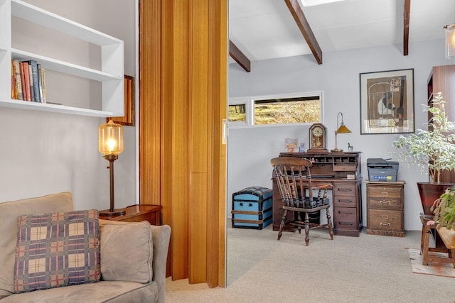 carpeted office featuring beam ceiling
