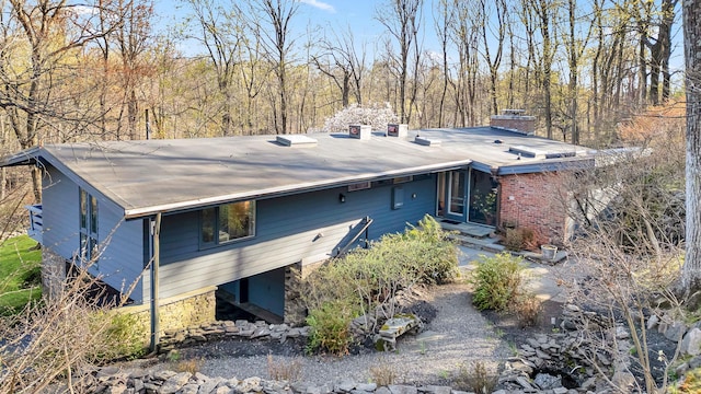 back of property featuring a chimney