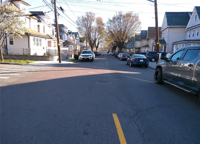 view of street featuring a residential view and sidewalks