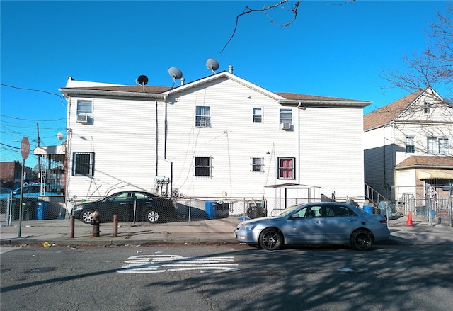 back of property with fence