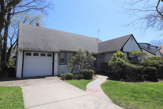 ranch-style home featuring a front lawn, driveway, roof with shingles, and a garage