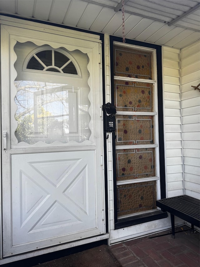 doorway to property featuring a porch