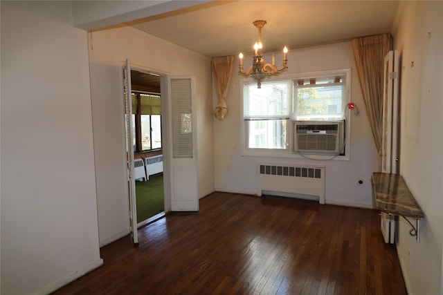 unfurnished dining area featuring a chandelier, cooling unit, radiator heating unit, and dark wood-type flooring