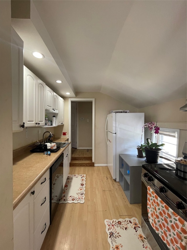 340 Rte 52, Carmel, NY 10512 - kitchen with stainless steel electric range oven, freestanding refrigerator, dishwasher, light wood finished floors, and white cabinetry