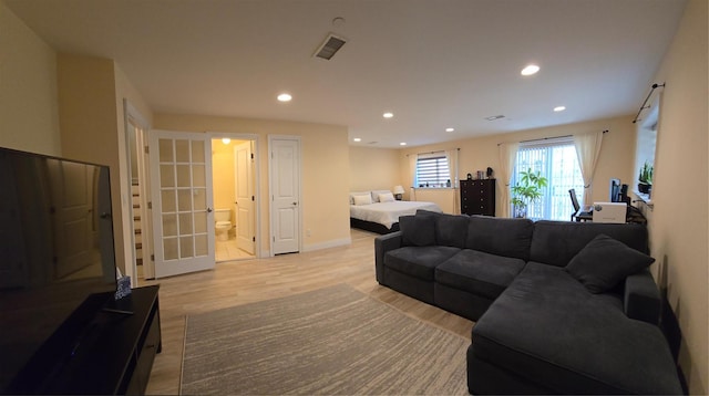 337 Park Cres, College Point, NY 11356 - living room featuring light wood-style floors, recessed lighting, french doors, and baseboards