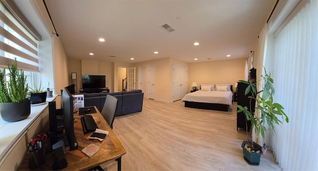 337 Park Cres, College Point, NY 11356 - bedroom with light wood-type flooring, recessed lighting, and multiple closets