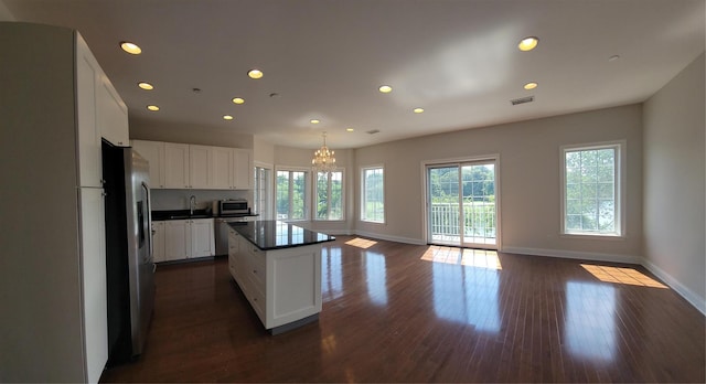 337 Park Cres, College Point, NY 11356 - kitchen with stainless steel appliances, a sink, a chandelier, baseboards, and recessed lighting