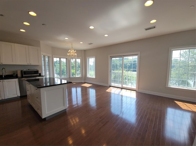 337 Park Cres, College Point, NY 11356 - kitchen featuring baseboards, a chandelier, dark countertops, dishwashing machine, and recessed lighting