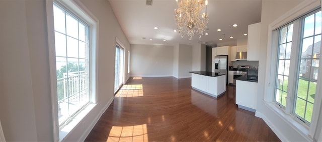 337 Park Cres, College Point, NY 11356 - kitchen featuring plenty of natural light, a kitchen island, a chandelier, dark wood-type flooring, and recessed lighting