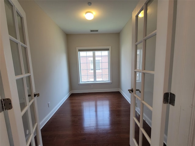 337 Park Cres, College Point, NY 11356 - unfurnished room featuring french doors, dark wood-style flooring, and baseboards