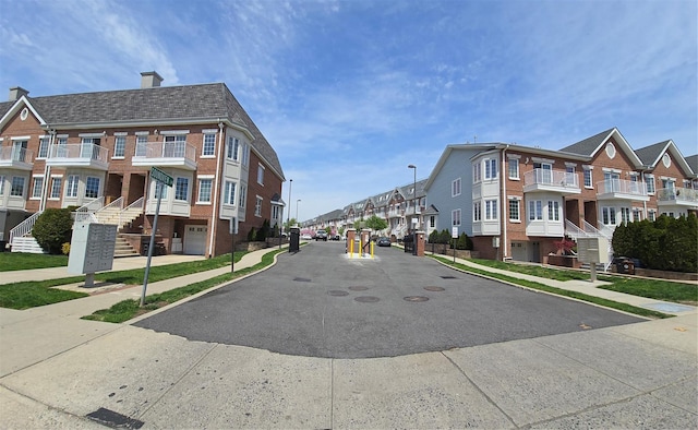 337 Park Cres, College Point, NY 11356 - view of asphalt street featuring sidewalks, a residential view, street lighting, and curbs