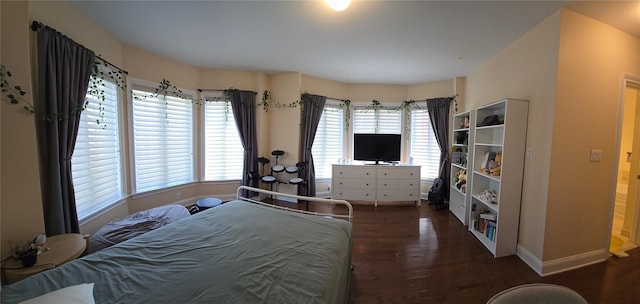 337 Park Cres, College Point, NY 11356 - bedroom with wood finished floors, multiple windows, and baseboards