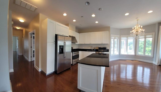 337 Park Cres, College Point, NY 11356 - kitchen featuring appliances with stainless steel finishes, baseboards, dark countertops, range hood, and recessed lighting