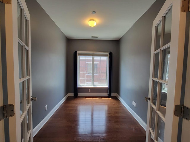 337 Park Cres, College Point, NY 11356 - spare room with french doors, wood finished floors, and baseboards
