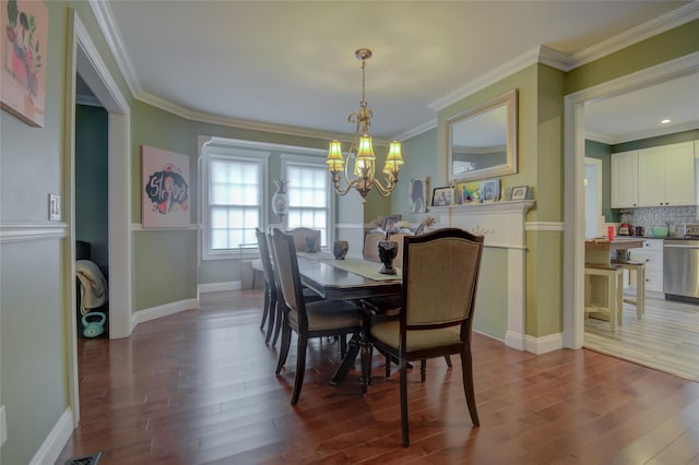 163 N Hamilton St, Poughkeepsie, NY 12601 - dining space featuring ornamental molding, baseboards, a notable chandelier, and wood finished floors