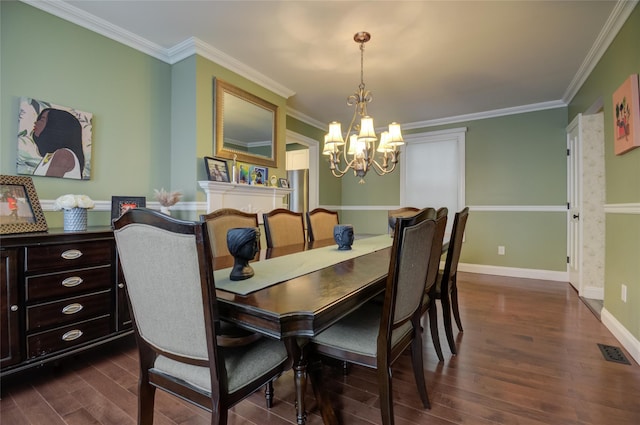 163 N Hamilton St, Poughkeepsie, NY 12601 - dining area with dark wood finished floors, baseboards, visible vents, an inviting chandelier, and ornamental molding