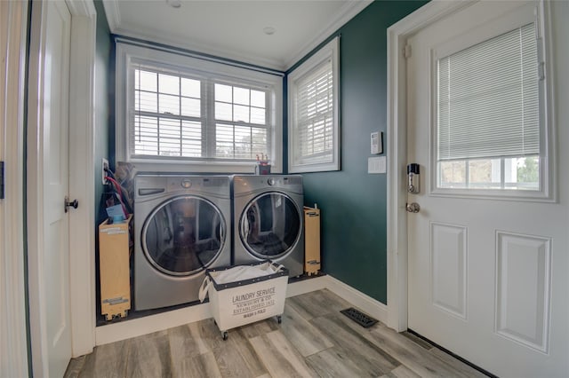 163 N Hamilton St, Poughkeepsie, NY 12601 - laundry room with crown molding, wood finished floors, washing machine and dryer, baseboards, and laundry area