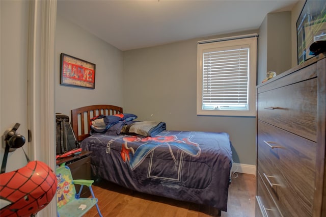 163 N Hamilton St, Poughkeepsie, NY 12601 - bedroom with baseboards and wood finished floors