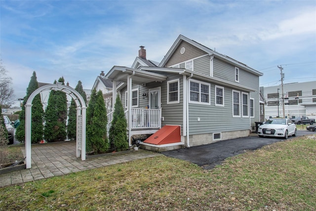 163 N Hamilton St, Poughkeepsie, NY 12601 - rear view of property featuring a yard and a chimney