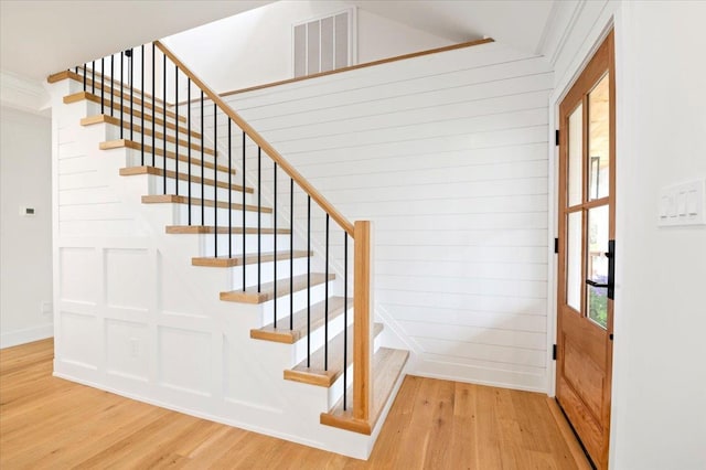 1000 Washington Dr, Centerport, NY 11721 - stairway featuring wood finished floors and wood walls