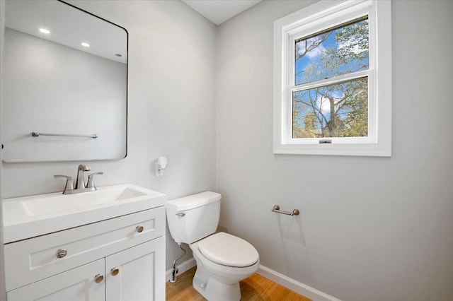 1000 Washington Dr, Centerport, NY 11721 - half bathroom with vanity and wood finished floors