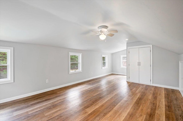 1000 Washington Dr, Centerport, NY 11721 - bonus room featuring a ceiling fan, plenty of natural light, lofted ceiling, and wood finished floors