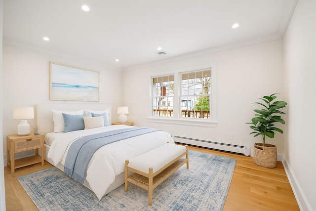 1000 Washington Dr, Centerport, NY 11721 - bedroom with a baseboard radiator, ornamental molding, light wood-style floors, and recessed lighting