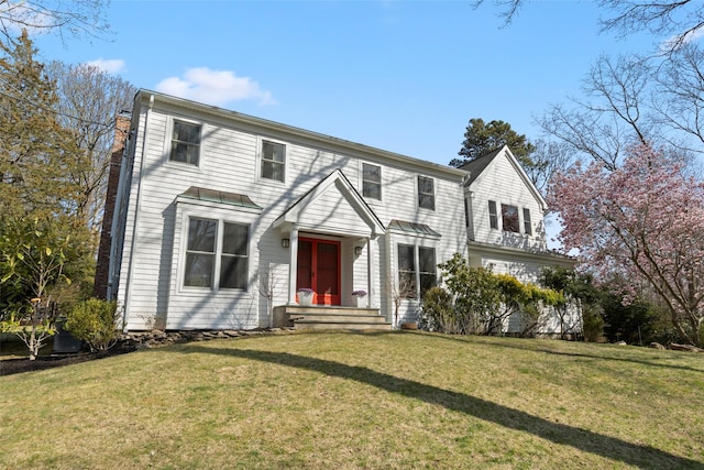 view of front of property with a front lawn