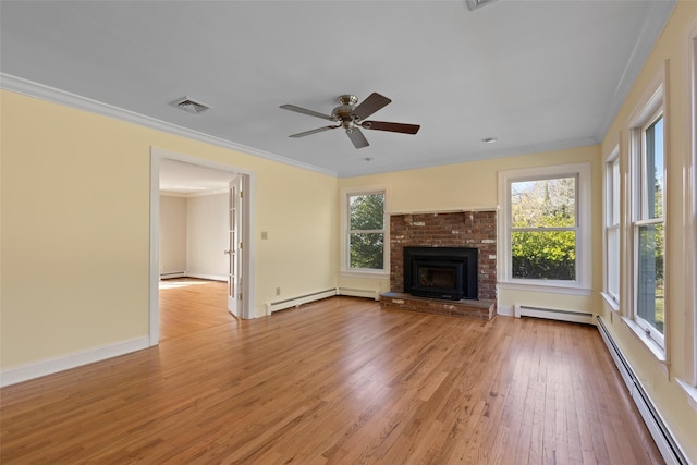 unfurnished living room with light wood finished floors, visible vents, crown molding, a baseboard radiator, and baseboard heating