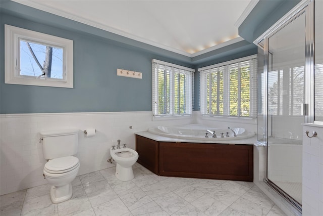 bathroom with marble finish floor, plenty of natural light, a bidet, and toilet