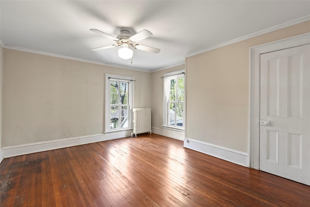 unfurnished room featuring a ceiling fan, hardwood / wood-style floors, radiator heating unit, and baseboards