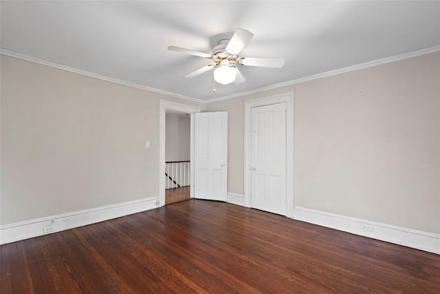 empty room featuring baseboards, wood finished floors, ceiling fan, and crown molding