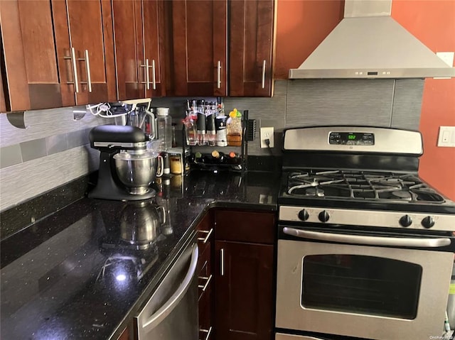 19 Tatterson St, Roslyn, NY 11576 - kitchen featuring dark stone counters, decorative backsplash, stainless steel appliances, and extractor fan