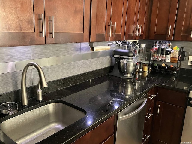 19 Tatterson St, Roslyn, NY 11576 - kitchen with stainless steel dishwasher, tasteful backsplash, dark stone countertops, and a sink