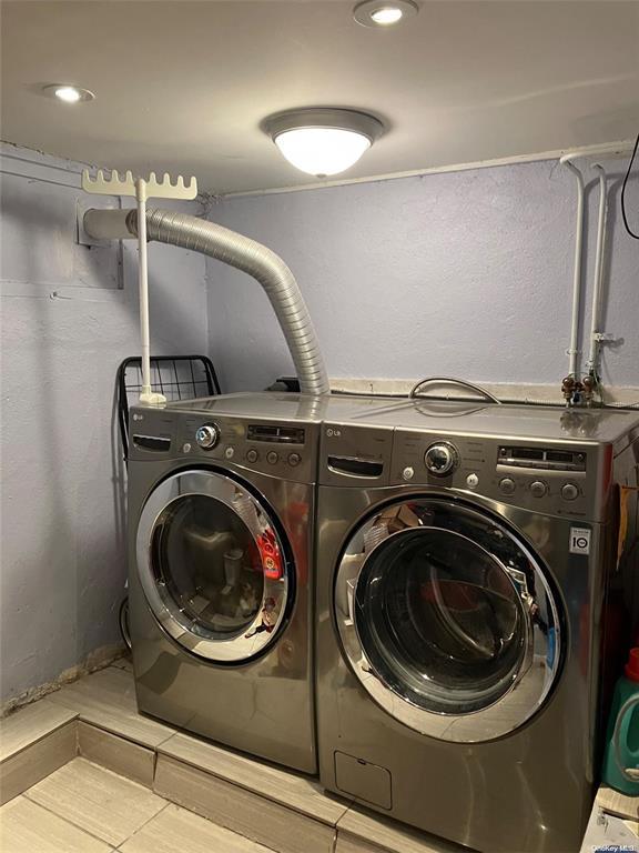 19 Tatterson St, Roslyn, NY 11576 - washroom with washer and dryer and laundry area